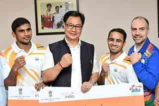Sports Minister Kiren Rijiju with the medal winning boxers Amit Panghal and Manish Kaushik. (Twitter/@KirenRijiju)