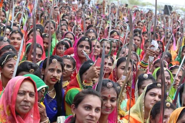 Bhawanis holding up their swords.
