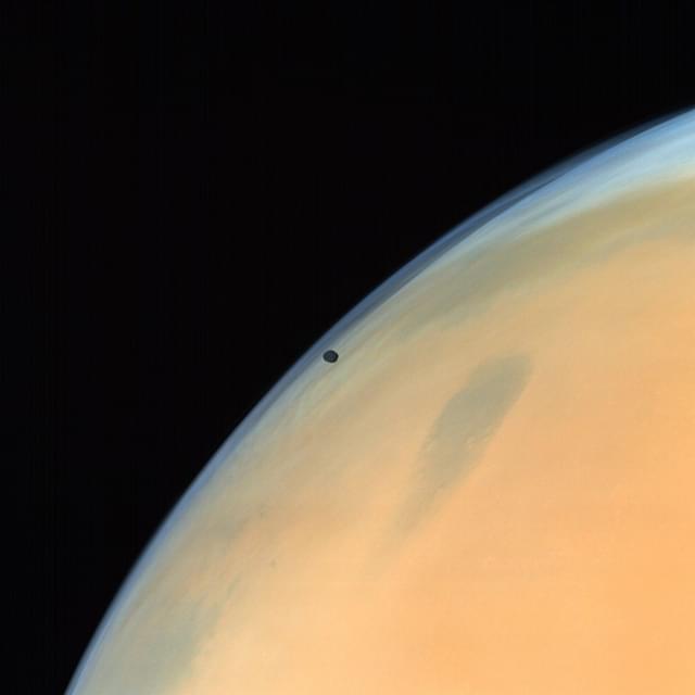 Phobos, one of the two natural satellites of Mars silhouetted against the Martian surface. (ISRO)&nbsp;