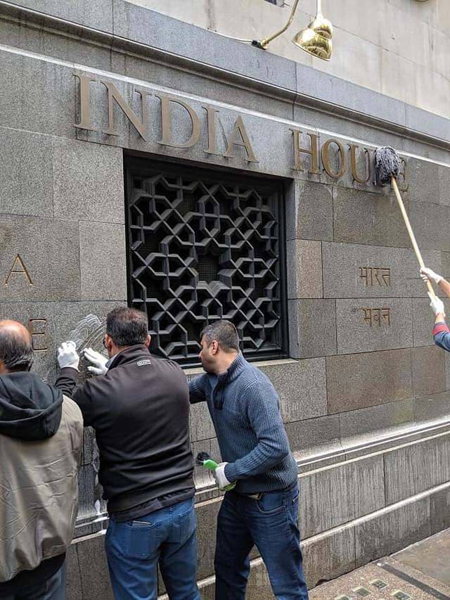 Indian volunteers cleaning the high commission’s walls