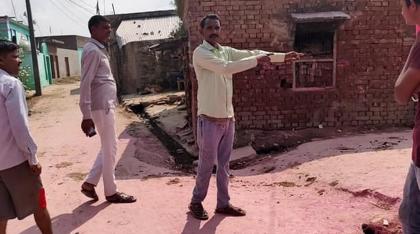 Rajesh Yadav shows the diversion for Durga idol just before the mosque