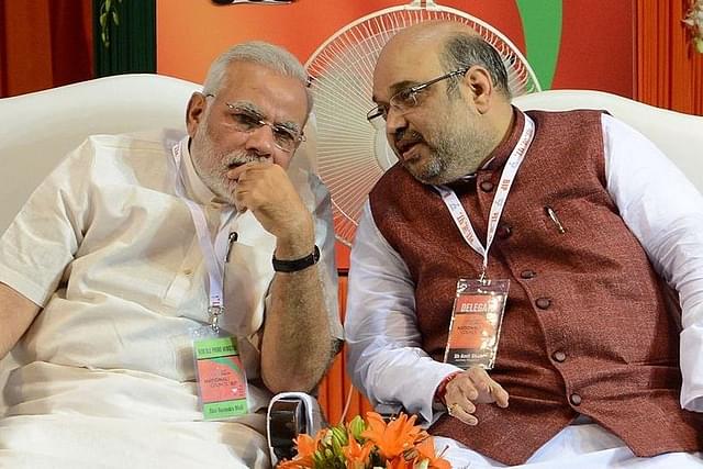 Prime Minister Narendra Modi with Home Minister Amit Shah. (Photo credit:  RAVEENDRAN/AFP/Getty Images))