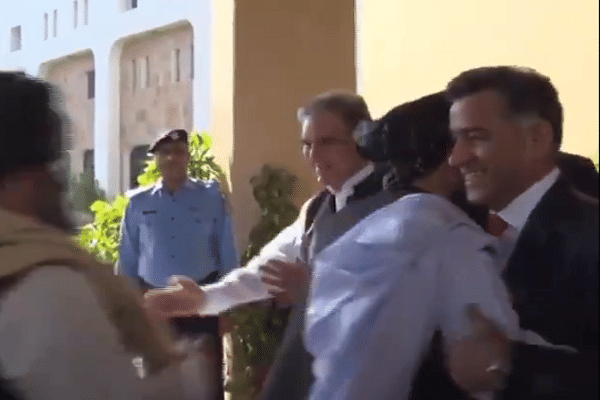 ISI Chief Lt Gen Faiz Hameed hugs a Taliban leader