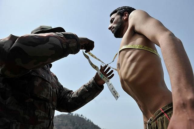 An Indianarmy officer measures the chest of a Kashmiri youth during an earlier recruitmentrally in Anantnag. (TAUSEEF MUSTAFA/AFP/GettyImages)