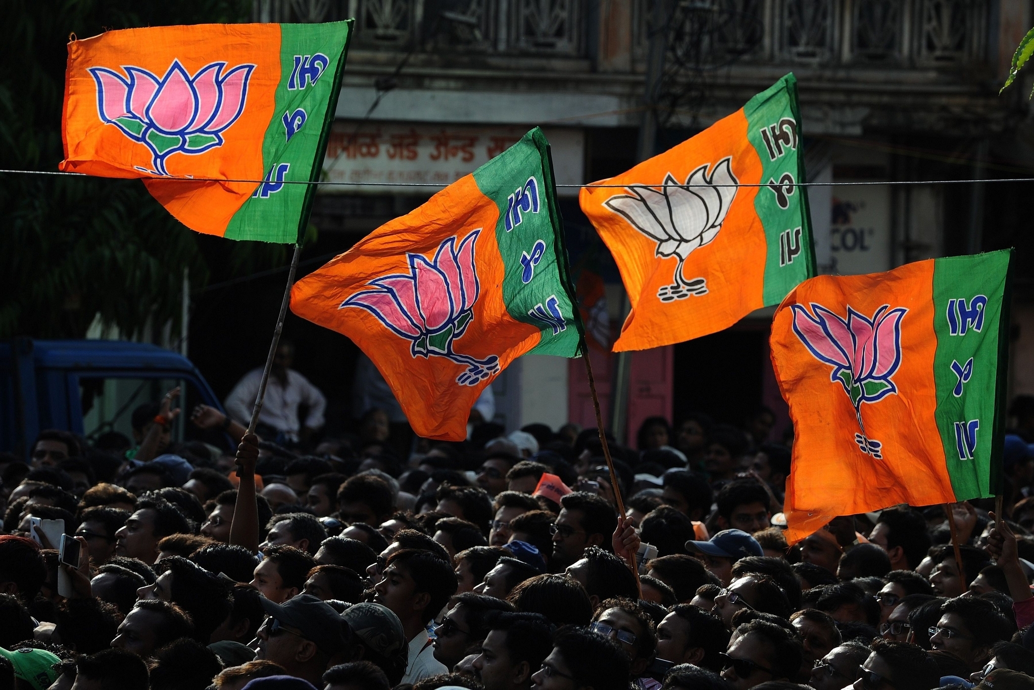 BJP supporters raise party flags. (Representative Image)