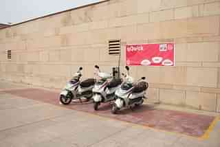 E-scooters parked outside a metro station. (Twitter/@OfficialDMRC)