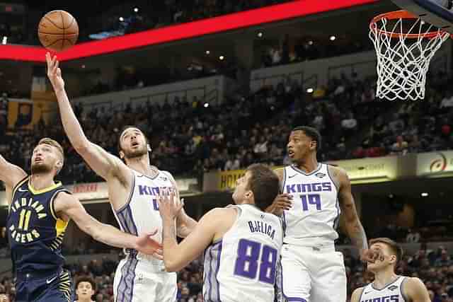 Players jostling for the basketball. (NBA.com)