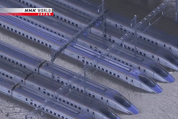 Trains during flooding caused by the typhoon. (@NHKWORLD_News/Twitter)