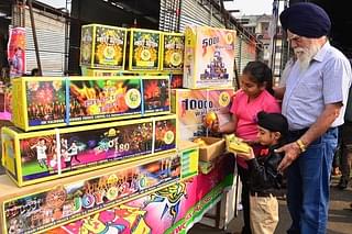 Children buy firecrackers ahead of Diwali festival at a market in New Amritsar. (Sameer Sehgal/Hindustan Times via GettyImages)&nbsp;