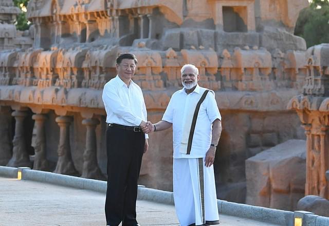 Prime Minister Modi in a veshti with Chinese Premier Xi Jinping at Mahabalipuram. (Narendra Modi/Twitter)