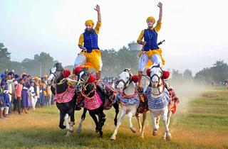Men of the armed Sikh order Nihang show their horse-riding skills during a religious procession on ‘Fateh Divas’, or ‘Victory Day’, in Amritsar on Monday (28 October 2019). PTI