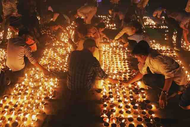 People lighting up diyas in Ayodhya. (representative image)