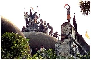 Hindu youth atop the disputed structure in Ayodhya.