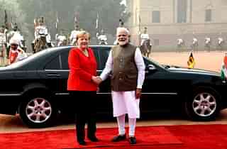 PM Modi with Angela Merkel. (PTI)
