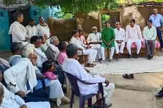 Khushwaha, seated, second from right, with villagers.