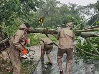 Odisha fire personnel removing uprooted trees in Baliapal area of Balasore. (Twitter/@BijayKumarShar7 - DG Police, Odisha)&nbsp;