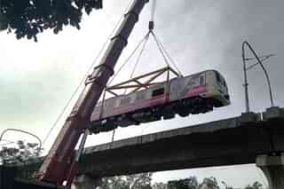 Pune Metro rake being hauled up via a heavy duty crane (@metrorailpune/Twitter)