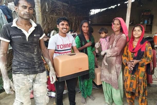 Lakshman (in Black Tshirt) with his family at the Adarsh Nagar camp in Delhi.
