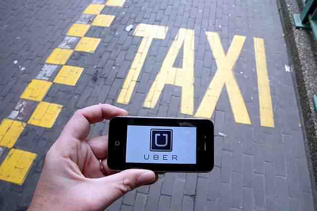 The Uber app. (NICOLAS MAETERLINCK/AFP/GettyImages)