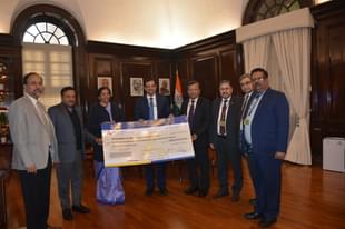 LIC officials handing over the cheque to Finance Minister Nirmala Sitharaman (Pic Via Twitter)