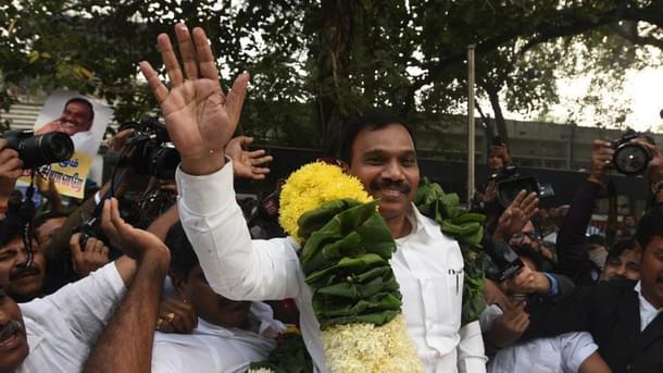 The telecom minister during UPA-2, A Raja, celebrates on being acquitted in the  2G spectrum case in 2017.