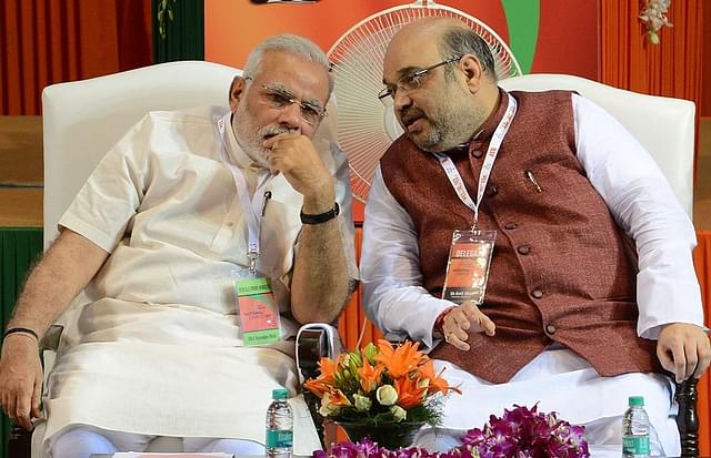 Prime Minister Narendra Modi with BJP president Amit Shah. (Photo credit:  RAVEENDRAN/AFP/Getty Images))