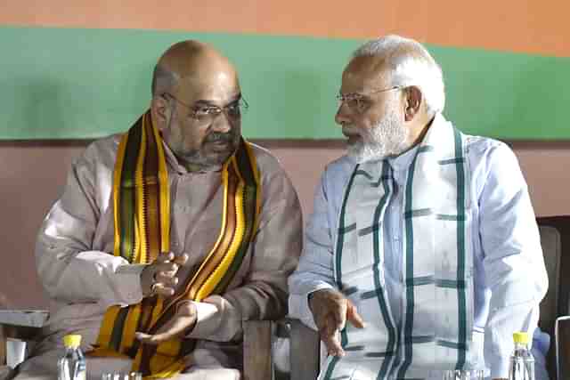 Prime Minister Narendra Modi with Home Minister Amit Shah. (Vipin Kumar/Hindustan Times via Getty Images)