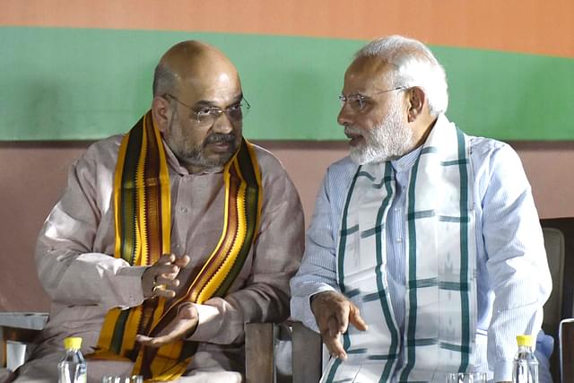 Prime Minister Narendra Modi with Home Minister Amit Shah. (Vipin Kumar/Hindustan Times via Getty Images)