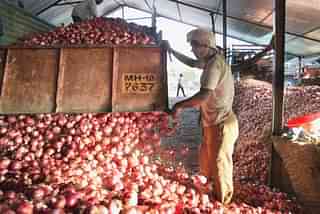 Onions being off-loaded at an agricultural produce yard.