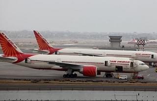 Air India aircraft are seen parked on the tarmac of the international airport in Mumbai. (Sattish Bate/Hindustan Times via Getty Images)