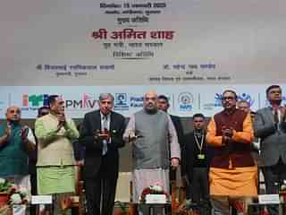 Union Home Minister with industrialist Ratan Tata among others. (Twitter/@BJP4India)