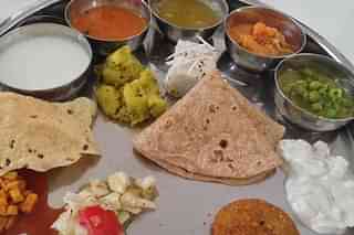 A Maharashtrian vegetarian meal with a variety of items. (Fatfoodie/Wikipedia)