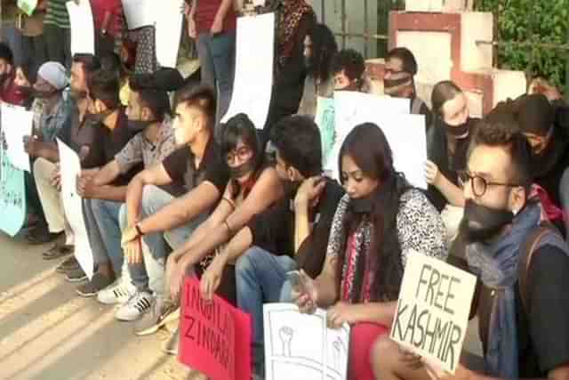 Protestors in Chennai with Free Kashmir placard. (Credits: ANI)