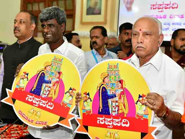 Chief Minister B S Yediyurappa alongwith Minister for Muzrai Kota Srinivas Poojary at the launch of the logo of the Saptapadi mass marriage scheme