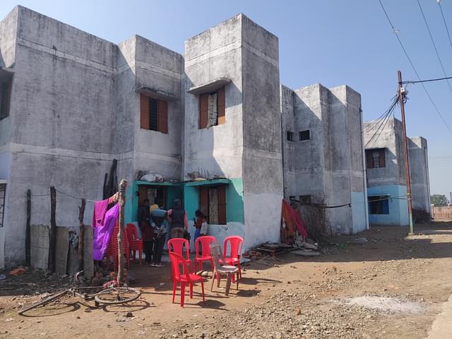 A view of Dhan Prasad’s house, where red chairs are placed. (Swati Goel Sharma/Swarajya Magazine)