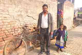 Lokesh with his wife and children at his house in Rabupura village in Uttar’s Pradesh Gautam Budh Nagar district on 9 January/Swati Goel Sharma