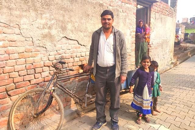 Lokesh with his wife and children at his house in Rabupura village in Uttar’s Pradesh Gautam Budh Nagar district on 9 January/Swati Goel Sharma