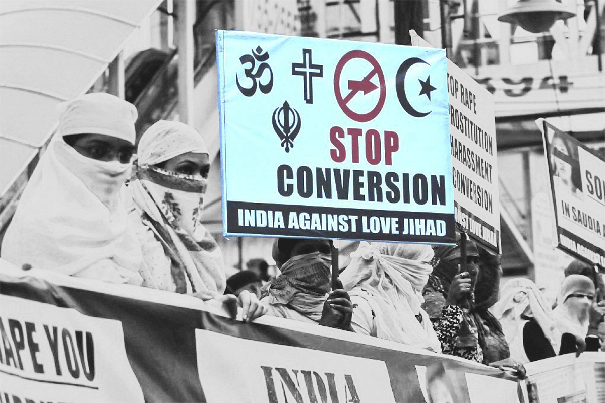 Women hold placards to protest against conversion to Islam. (Mujeeb Faruqui/Hindustan Times via GettyImages) 