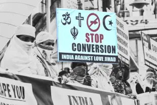 Women hold placards to protest against conversion to Islam. (Mujeeb Faruqui/Hindustan Times via GettyImages)