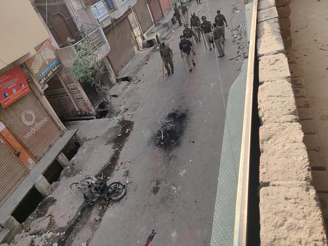 View of the site of the attack from a rooftop. The duo was travelling on the bike that is burnt now 