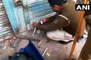 Tahir Hussain’s factory being sealed by the cops (@ANI/Twitter)