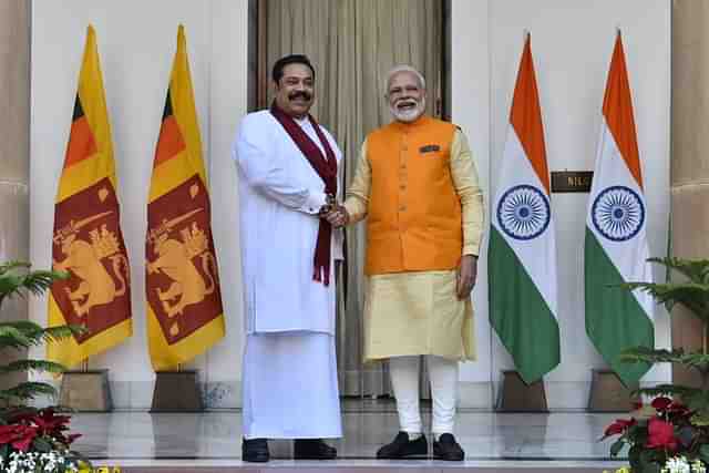 PM Modi with Sri Lankan PM Mahinda Rajapaksa (Pic Via Twitter)