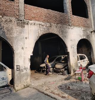 The burnt vehicles in Pradeep’s parking&nbsp;