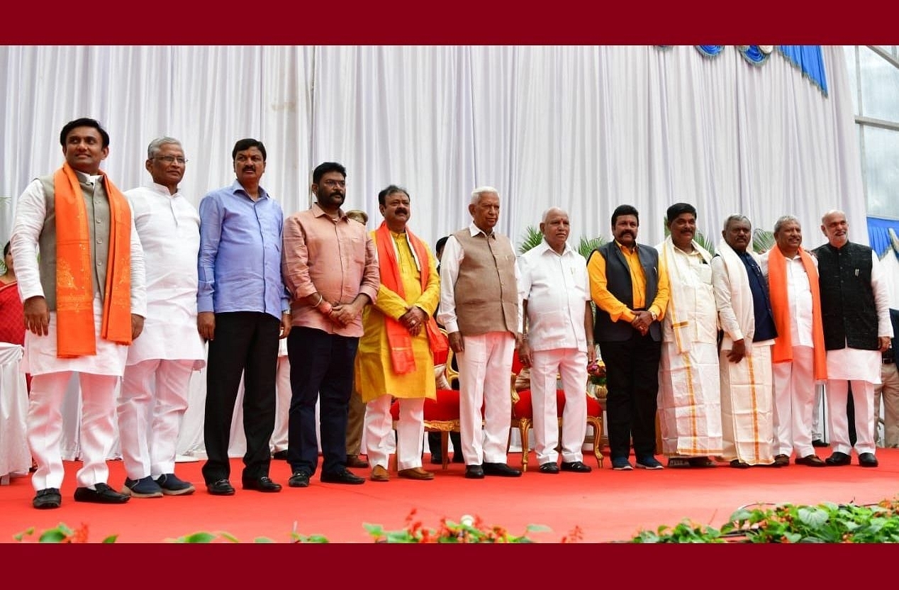 Chief Minister B S Yediyurappa with the newly-inducted cabinet ministers.