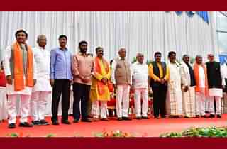 Chief Minister B S Yediyurappa with the newly-inducted cabinet ministers.