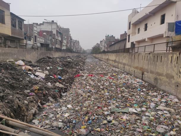The drain in which Sharma’s body was found. The spot is where the sticks are placed 
