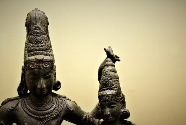 Alingana Chandrasekarar form: Note the asymmetrical earrings of Shiva while not so in the goddess. (Thanjavur Museum)