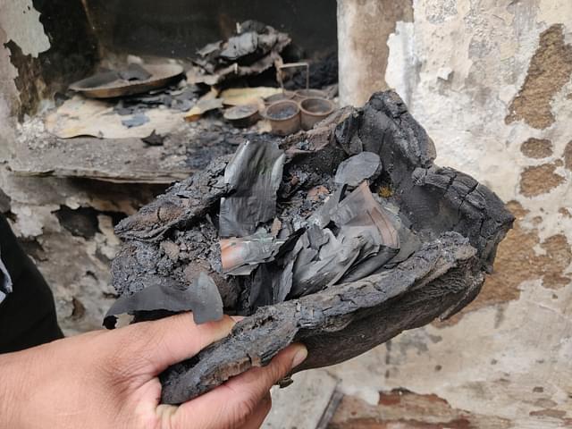 Charred currency notes in one of the affected houses.