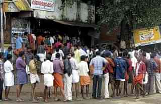 File photo of a queue outside a liquor shop in Kerala.