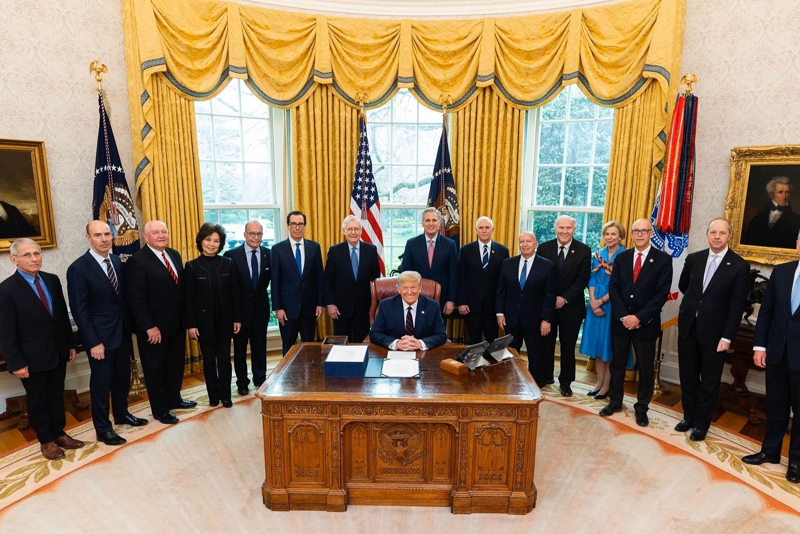 Trump with Senator Mitch McConnell and others during the signing of the bill (Pic Via Twitter)